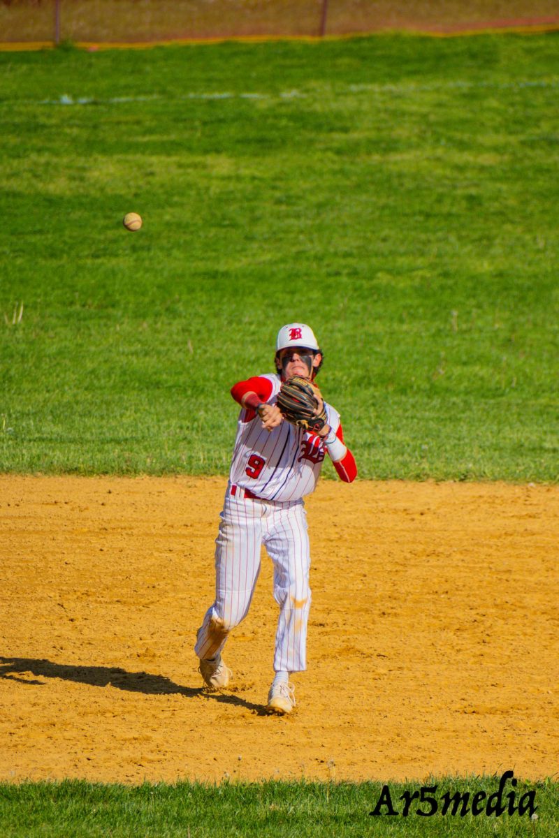 Senior Ryan Tondo making a throw to first during a game against Union Catholic  