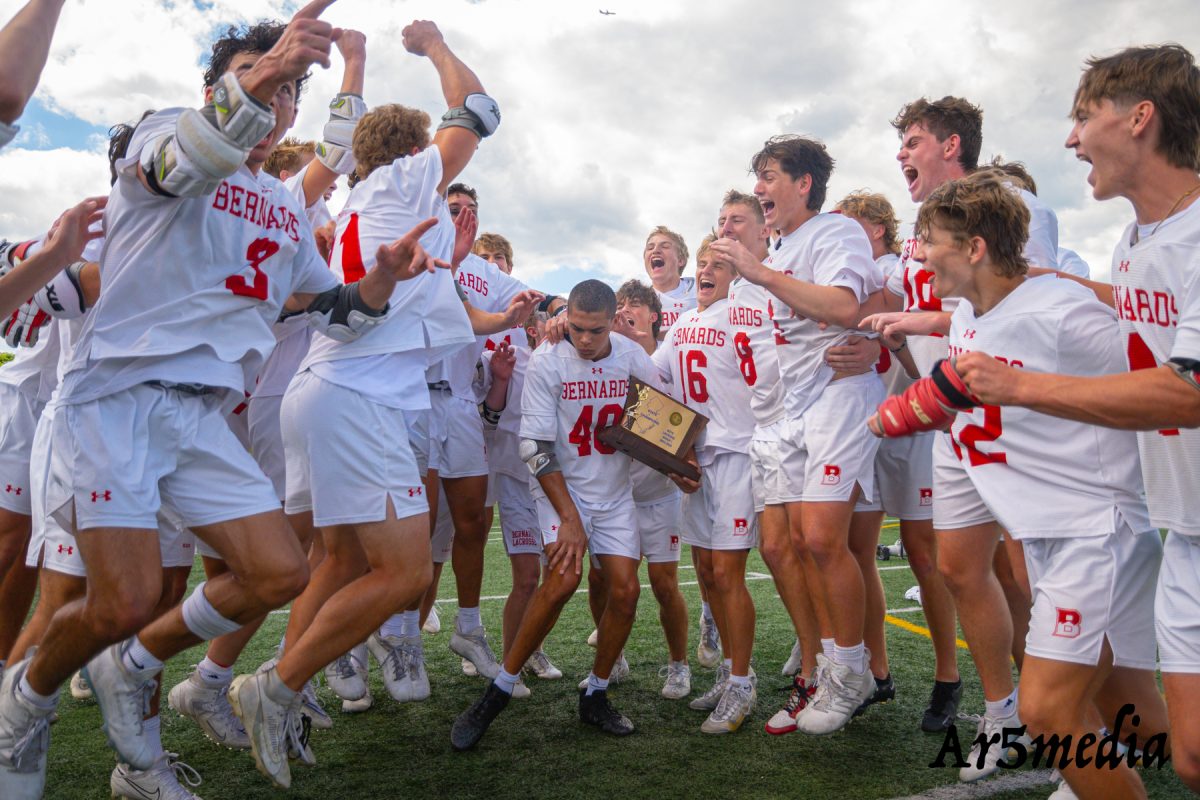 The boys lacrosse team celebrating after winning the state championship 