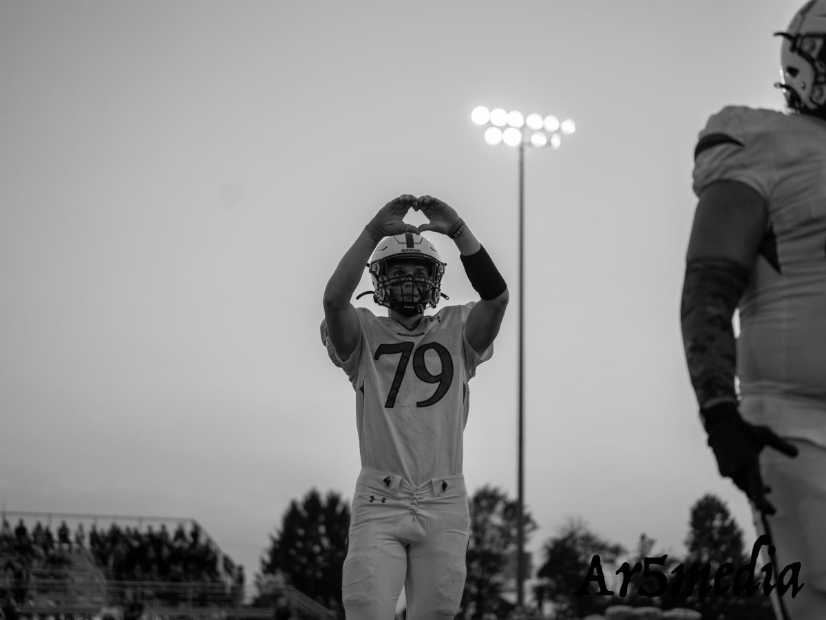 Danny Fergouson showing a heart after the coin toss against Del Val