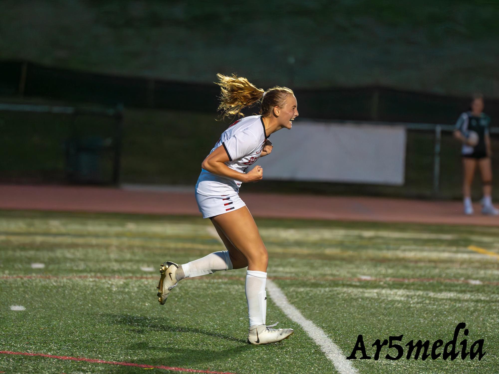 Jane Stauffer celebrating a huge goal against Ridge 