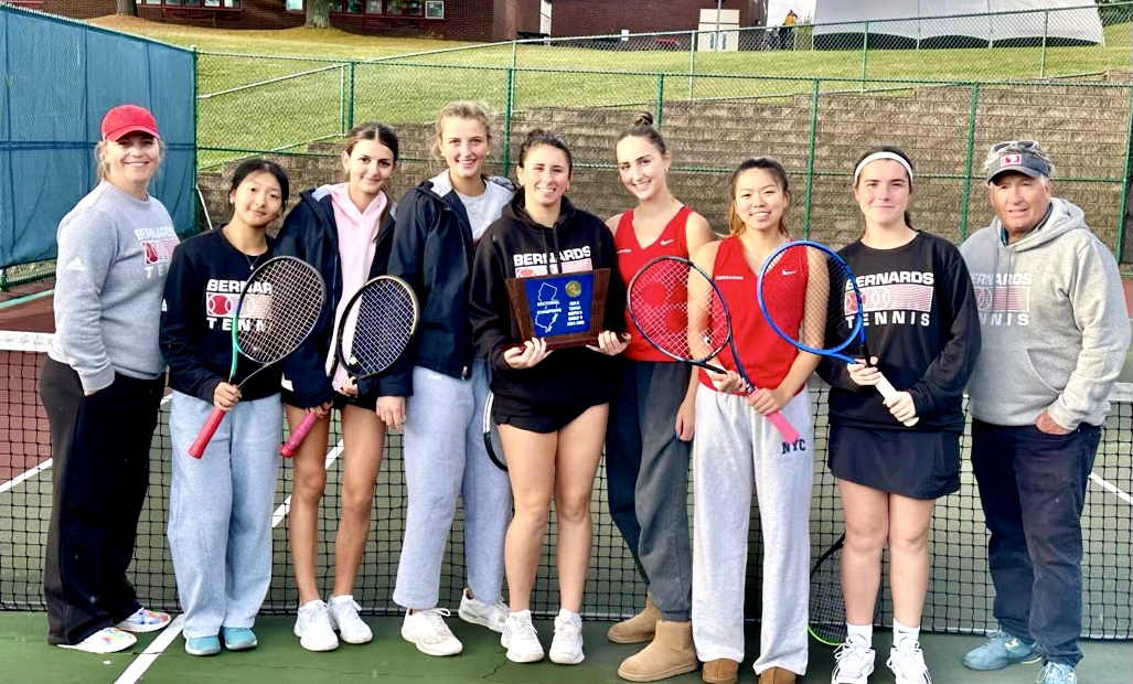 Girls Tennis varsity team celebrates their second consecutive State Sectional championship.