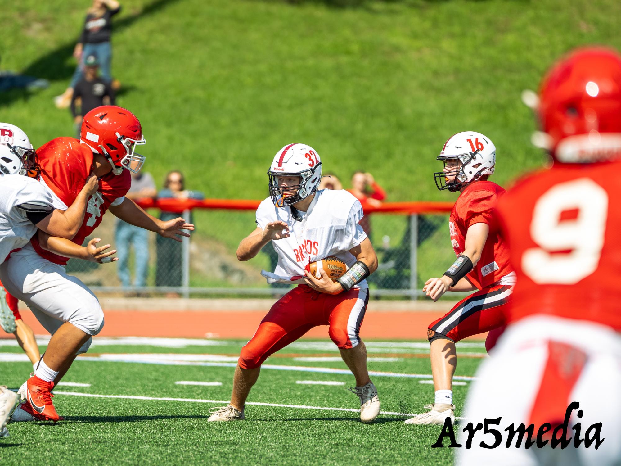 Junior Running Back Logan Stevens running the ball in a scrimmage against Lakeland