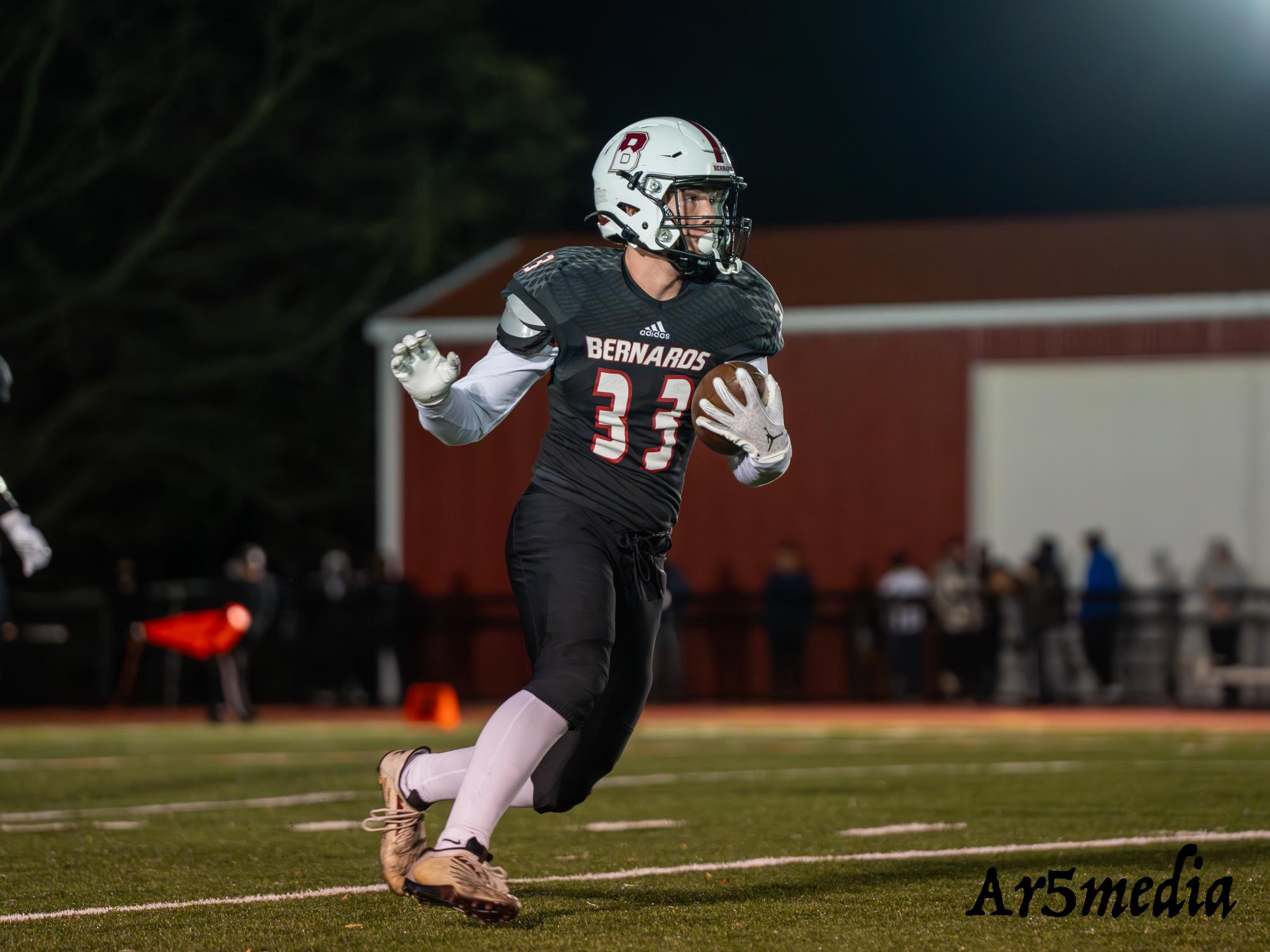 Junior Teagun Hartnett returning a kick off in a game against Shabazz 