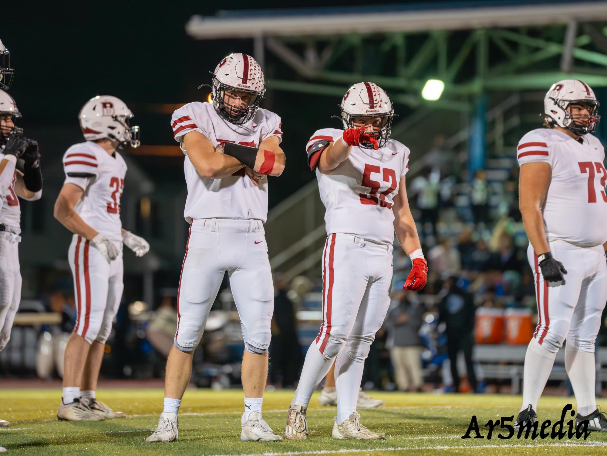 Danny Ferguson and Chase Caponigro celebrating before a play against Carteret.