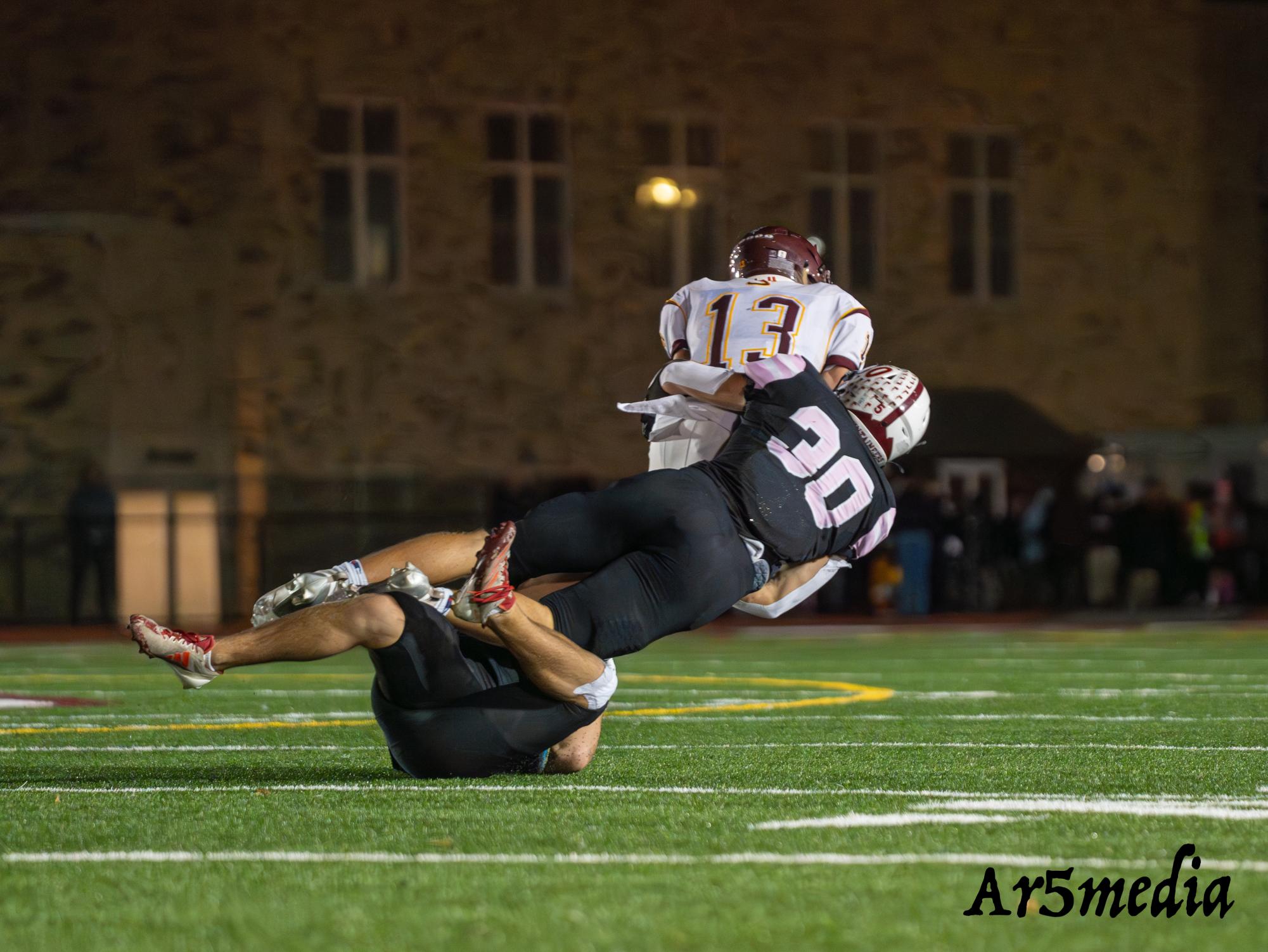 Senior Terrance Hanratty making a diving tackle in a game against Summit