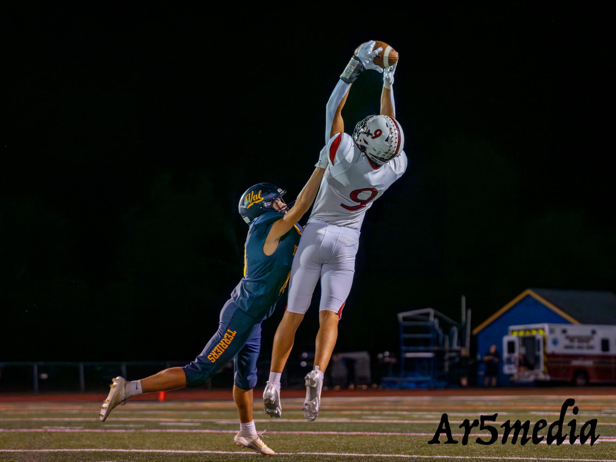 Senior Jack Morra leaping up for a catch during a game against Del Val