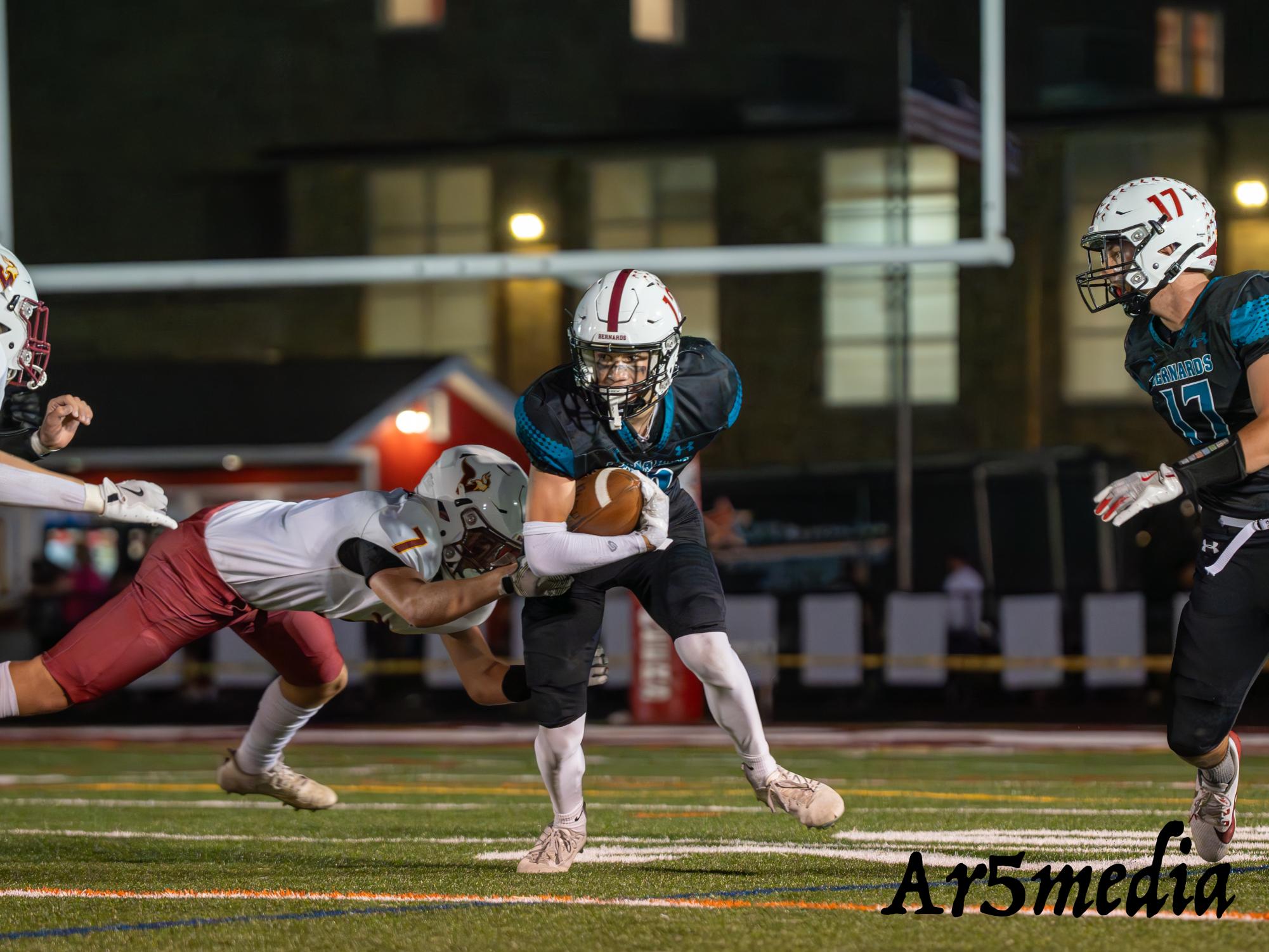 Senior Wide Receiver Max Austin running the ball up field in a game against Voorhees 