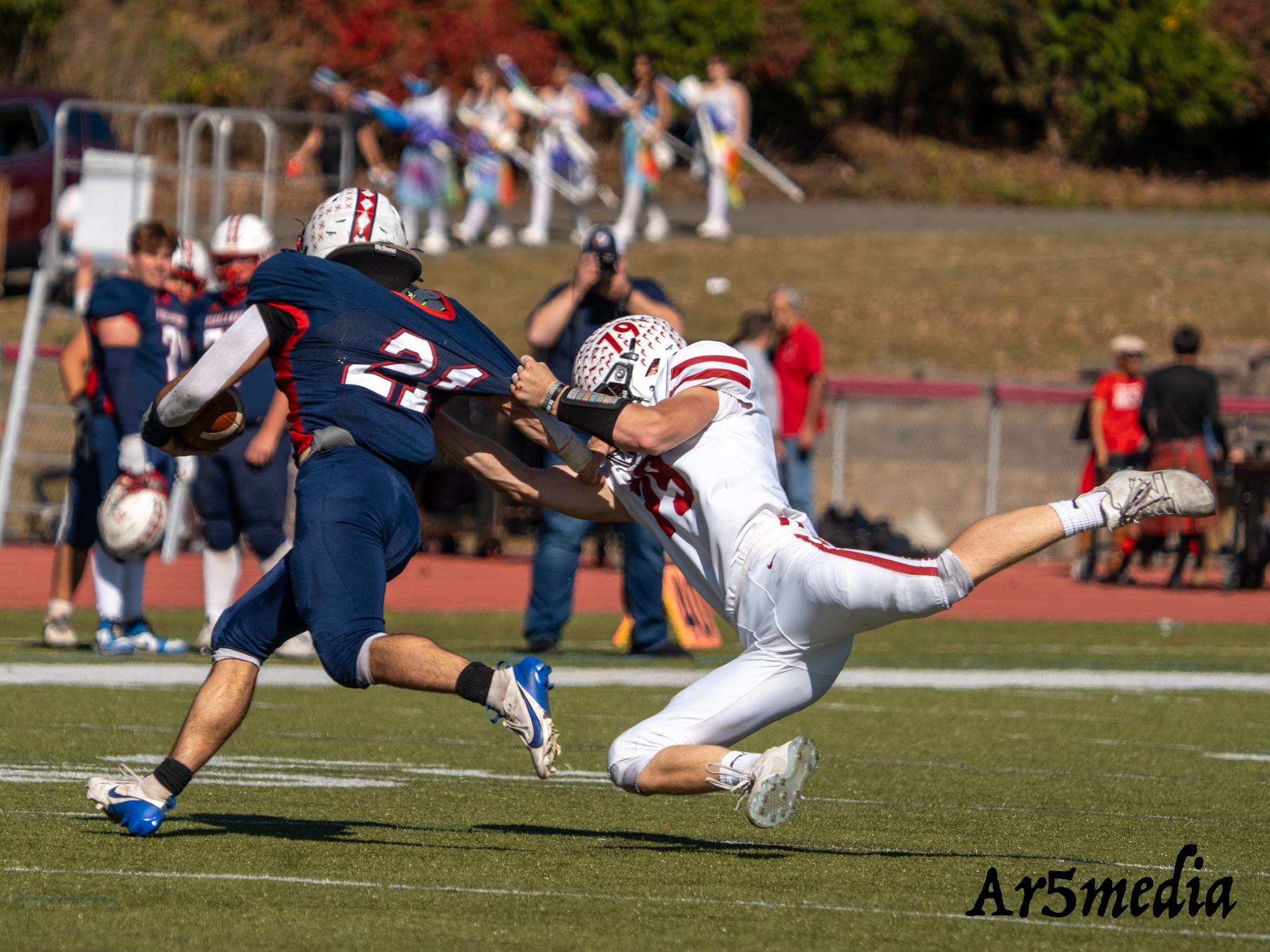 Senior Danny Ferguson making a diving tackle in a game against Gov Liv