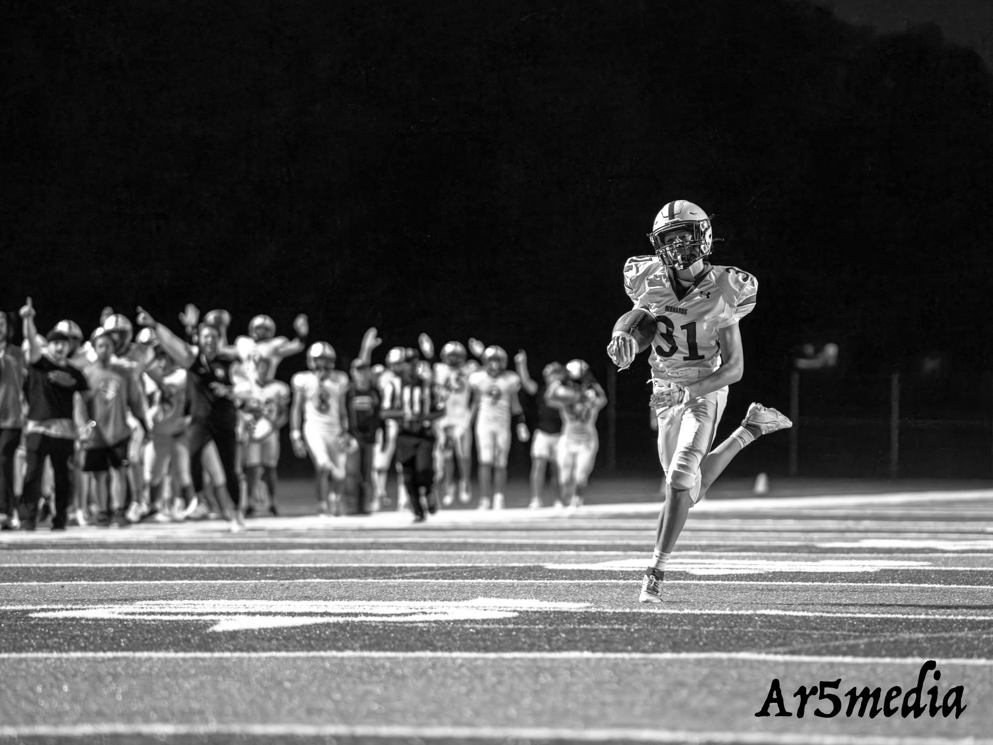 Sophomore Zach Favreau returning a blocked punt for a touchdown in a game against JP Stevens.