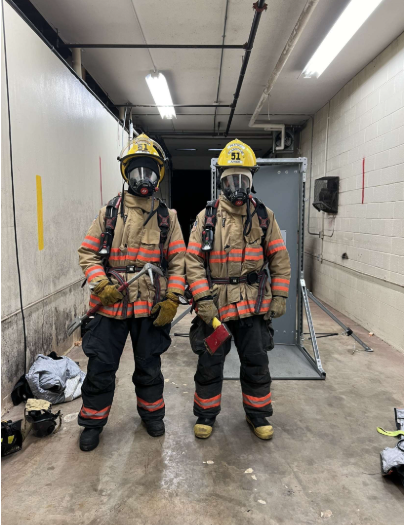 Grayson (right) performs during training at the PGFD